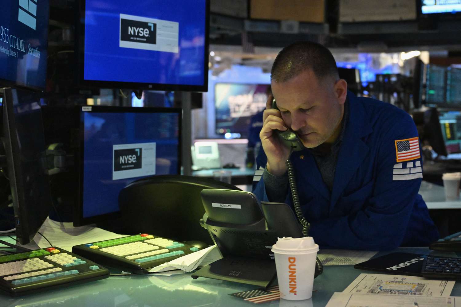 Traders works the floors at the New York Stock Exchange (NYSE).