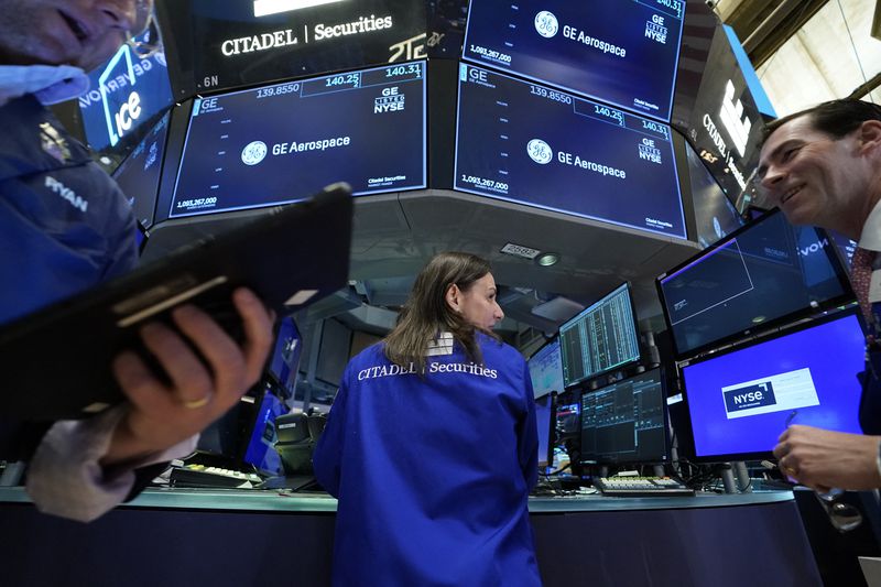 Traders work on the floor of the New York Stock Exchange (NYSE).