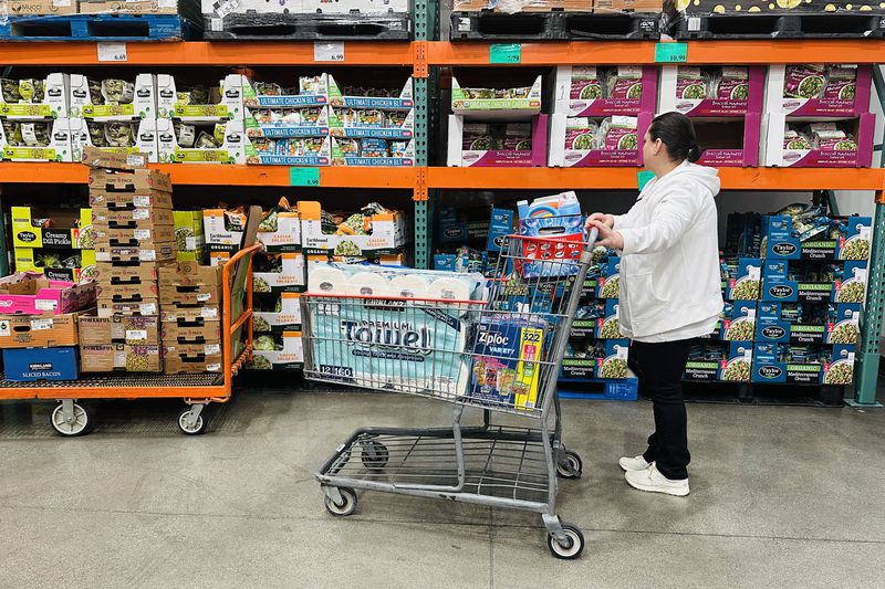 A woman shops for items at a Costco store.