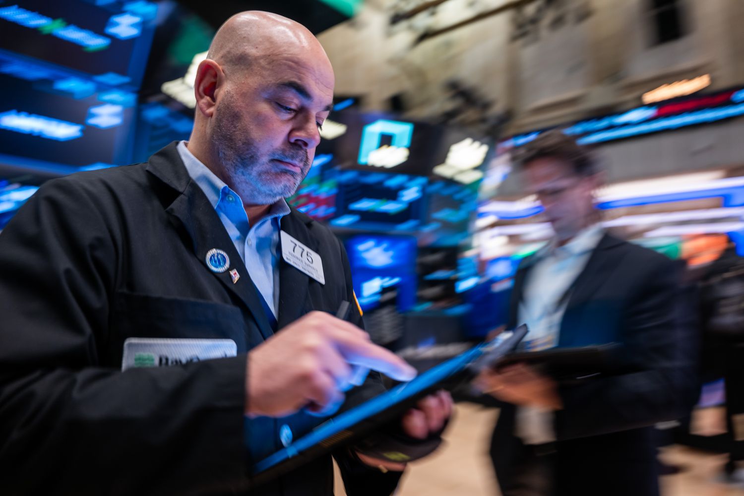 Traders work on the floor at the New York Stock Exchange.