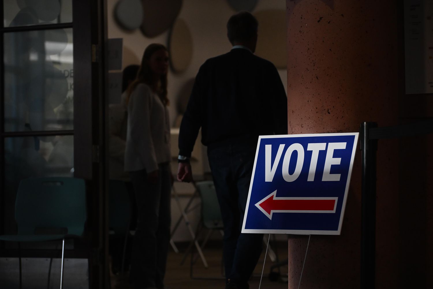 People wait to vote in Boulder, Colo., earlier today. 