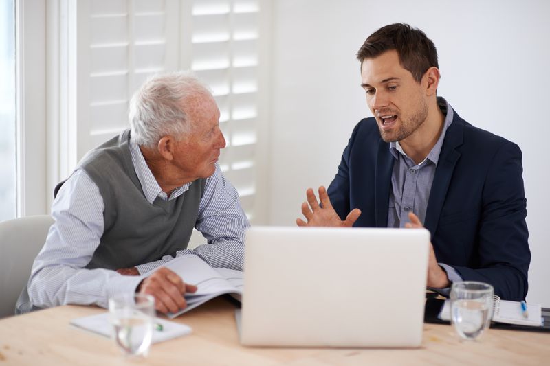 A young businessman explaining information to a client.