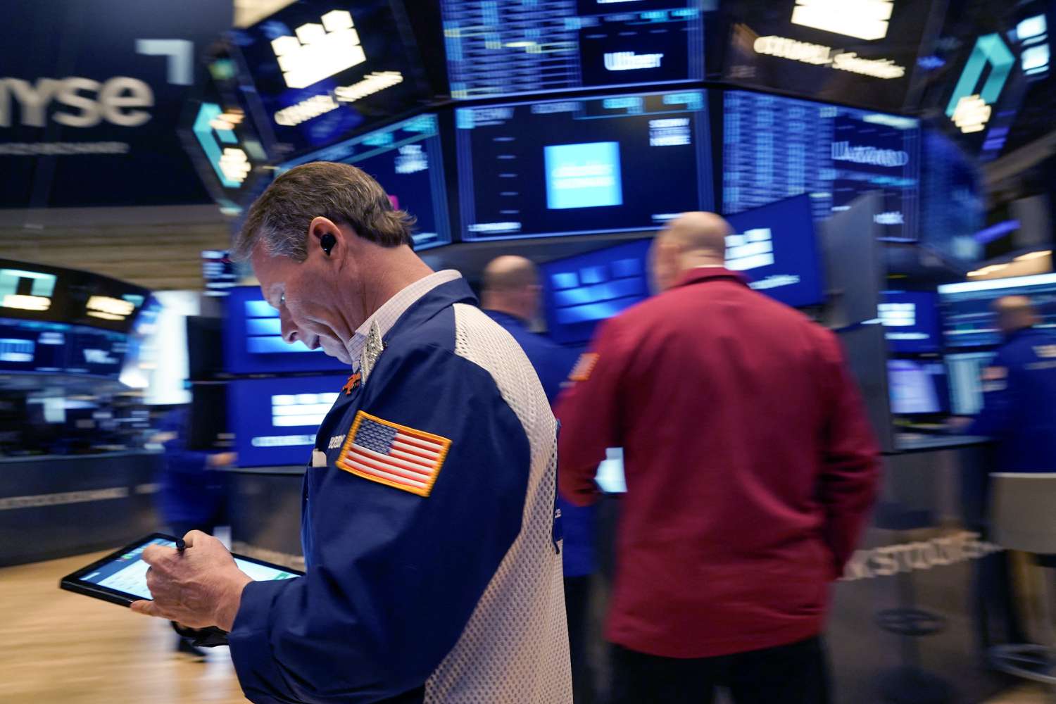 Traders work on the floor of the New York Stock Exchange (NYSE) at the opening bell on January 30, 2025, in New York City. 