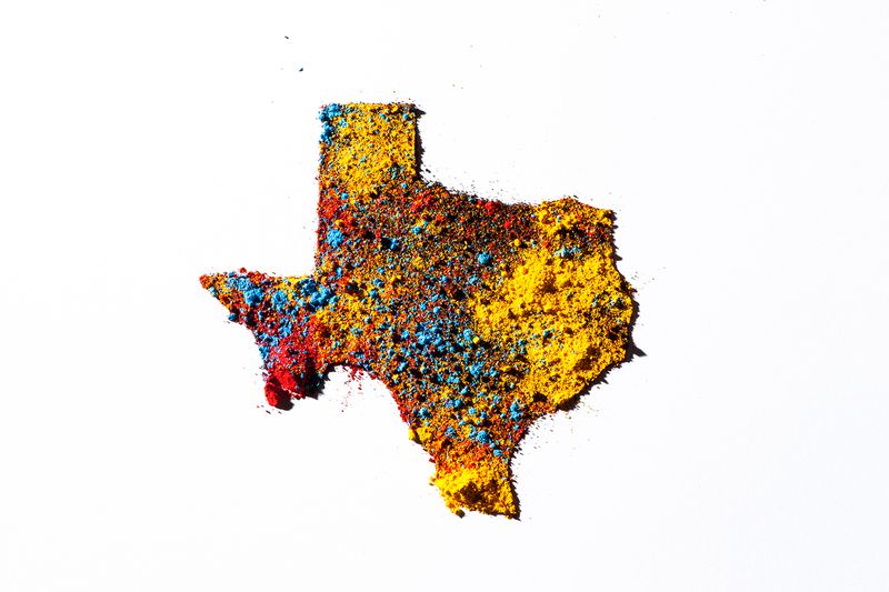 Map of Texas, USA, with colored powder.