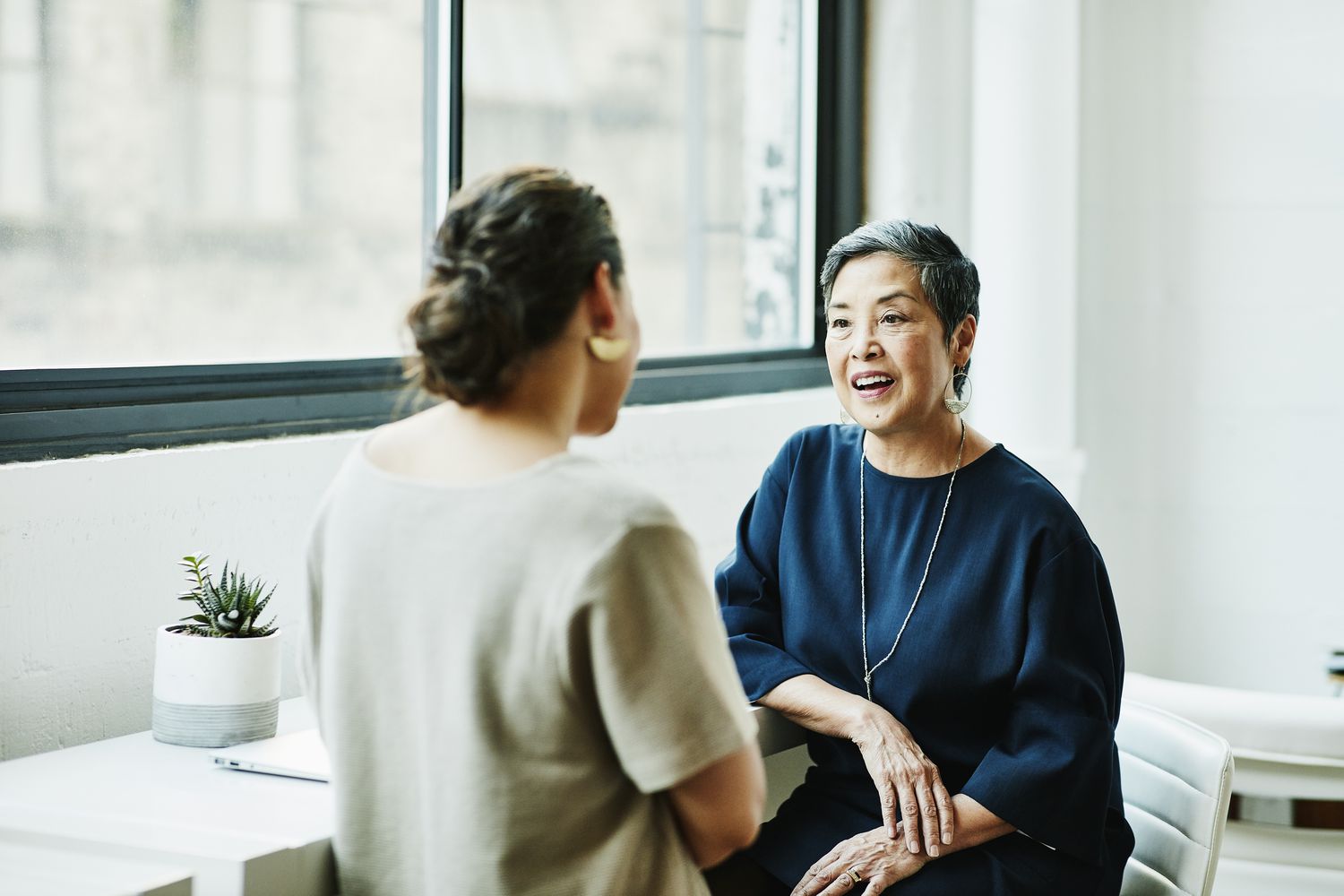 Woman speaks with a credit counselor