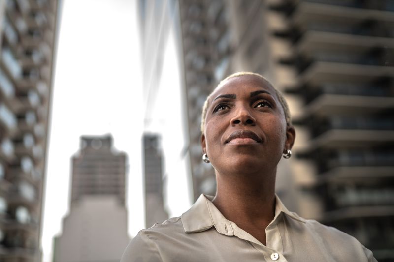 Gen X woman looking at buildings.