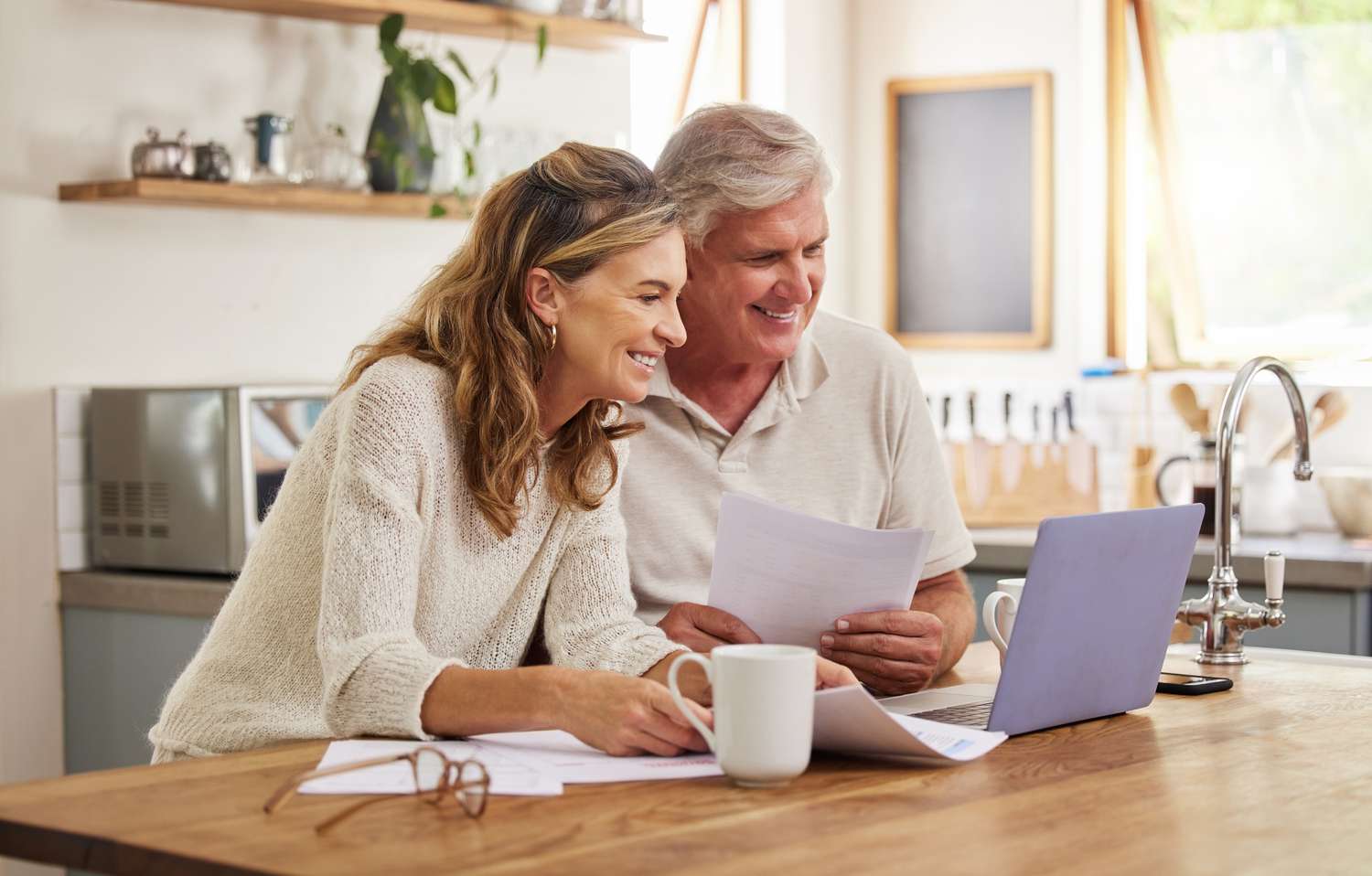 Older couple at home with a computer