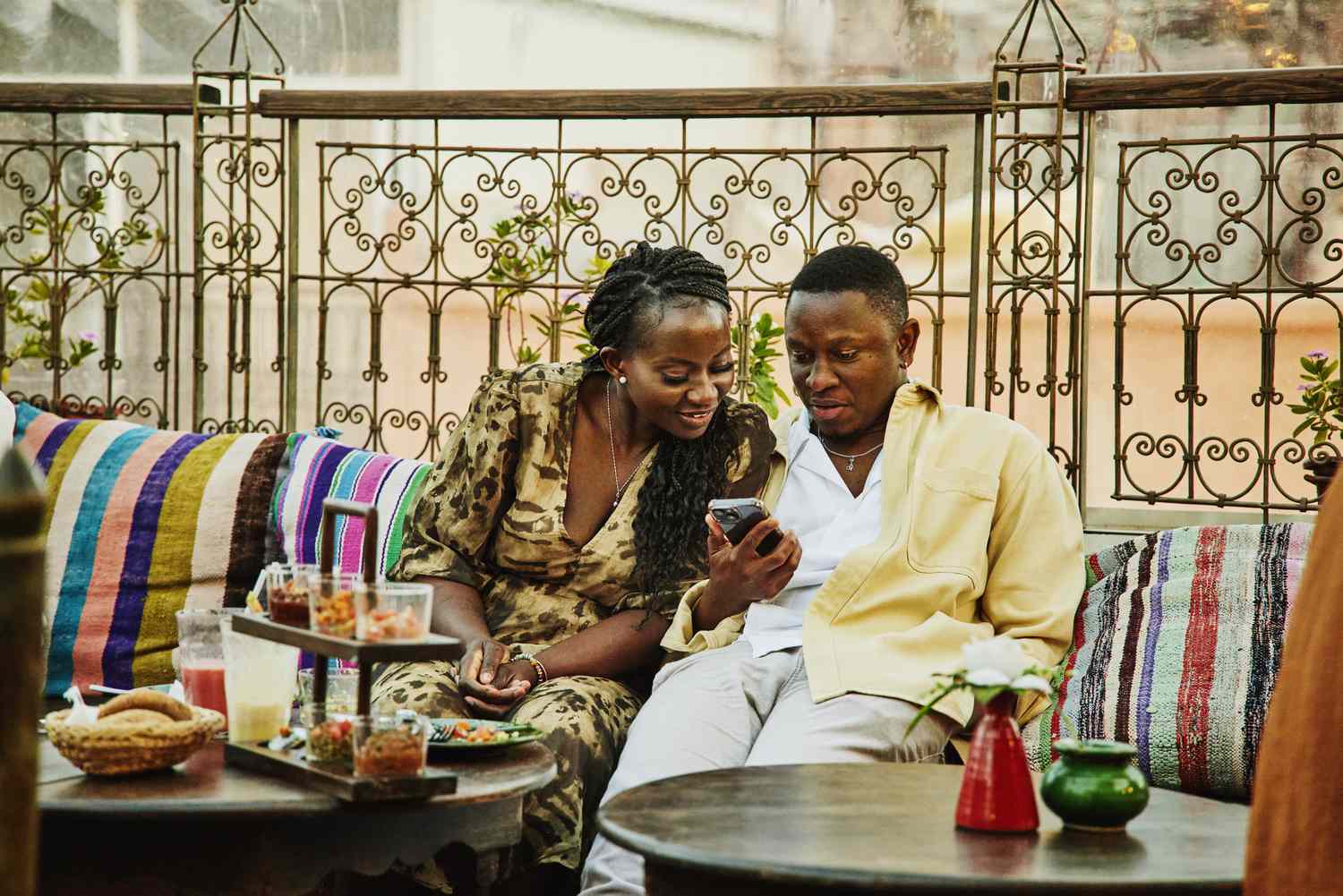 Couple on vacation looking at a smartphone