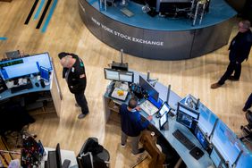Traders work on the floor of the New York Stock Exchange (NYSE) 