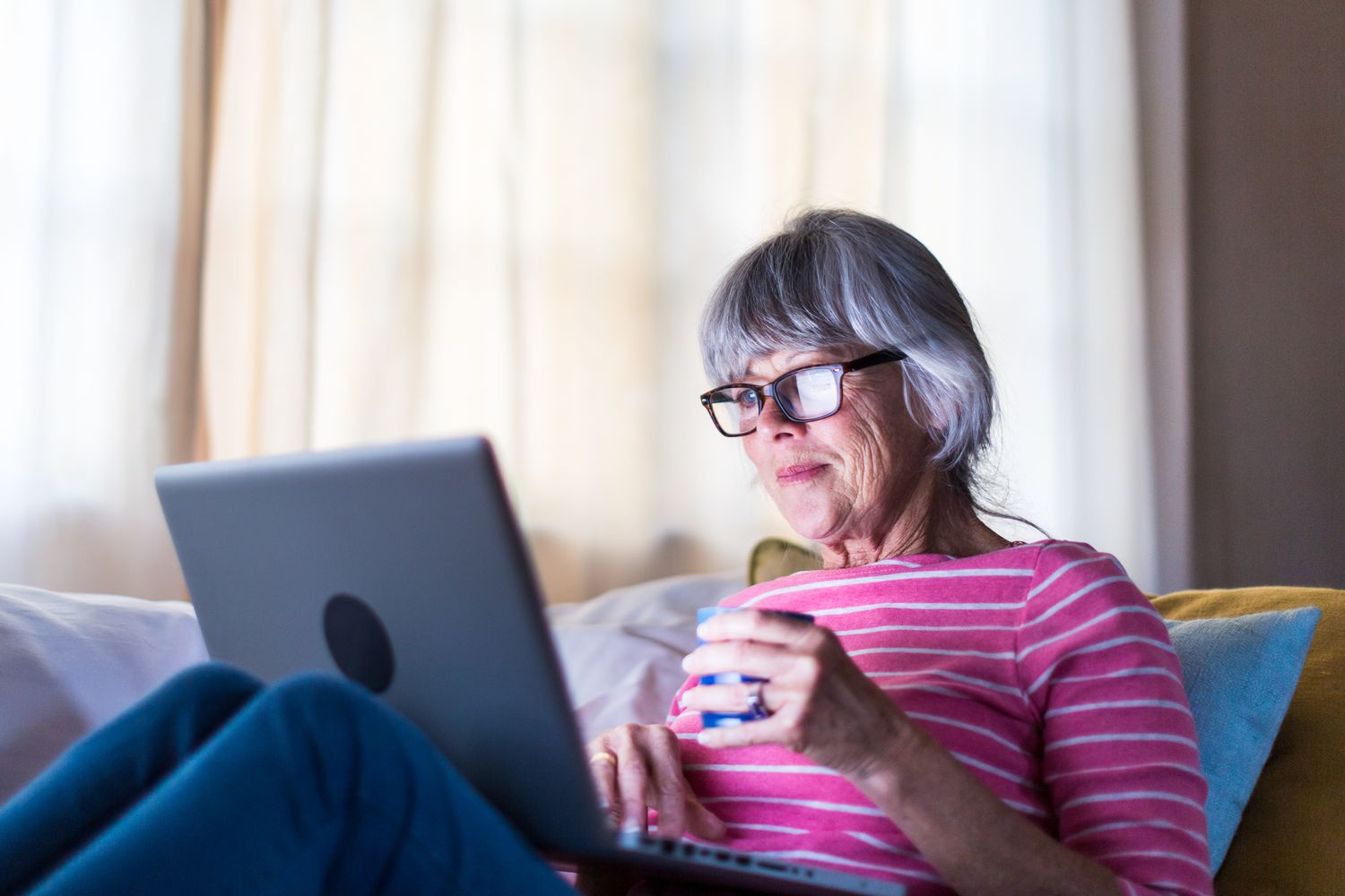 Older woman looking at laptop computer