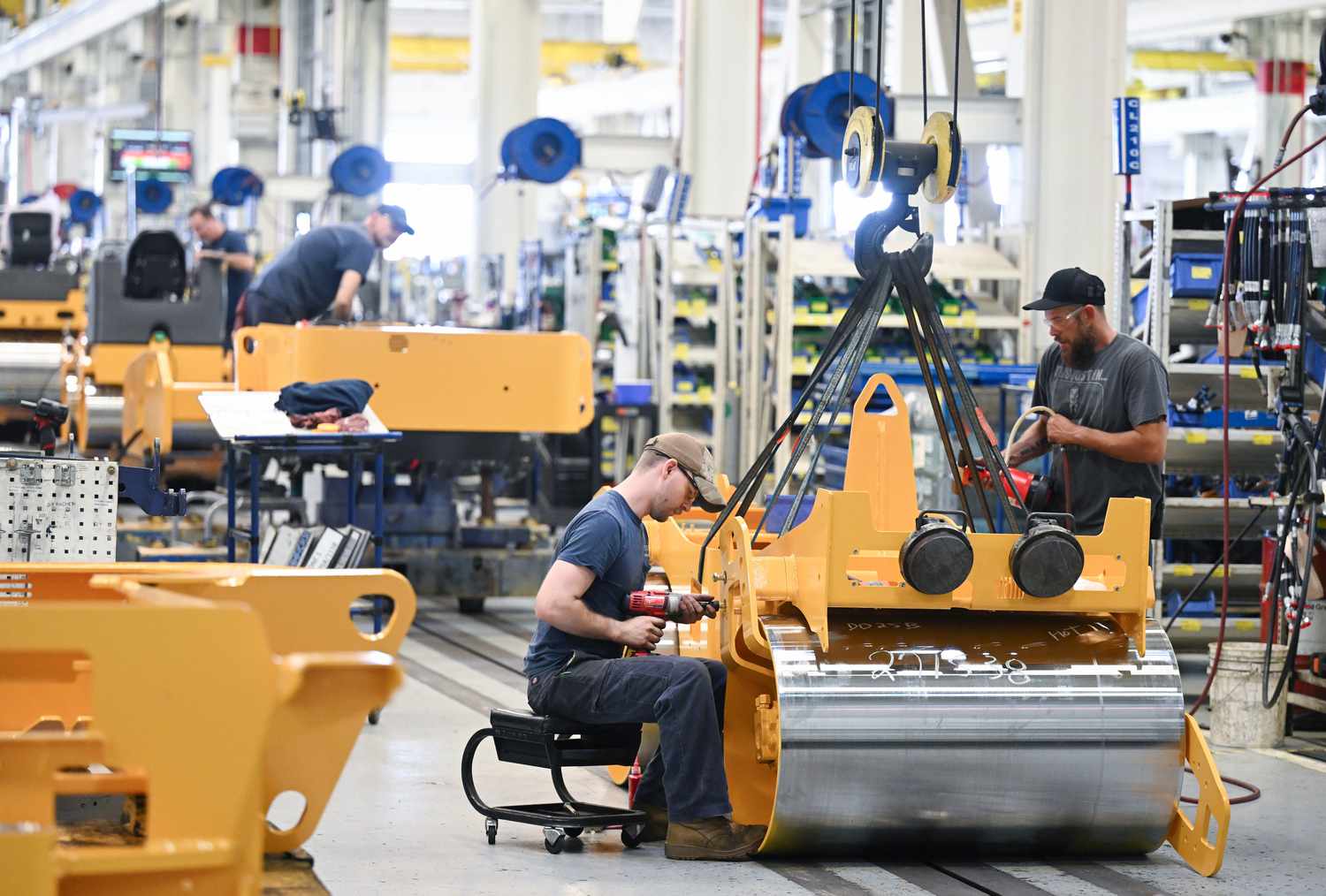 Workers are seen on an assembly line for compactors at Volvo Construction Equipment plant in Shippensburg, PA. 