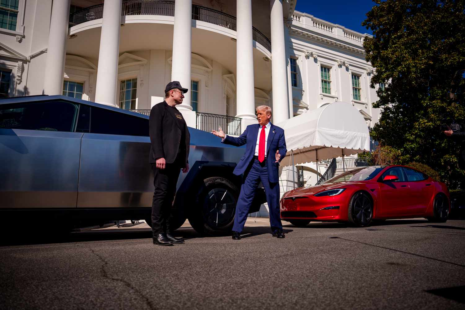 Elon Musk and Donald Trump appear during an event to promote Tesla vehicles outside the White House on Marc 11, 2025.