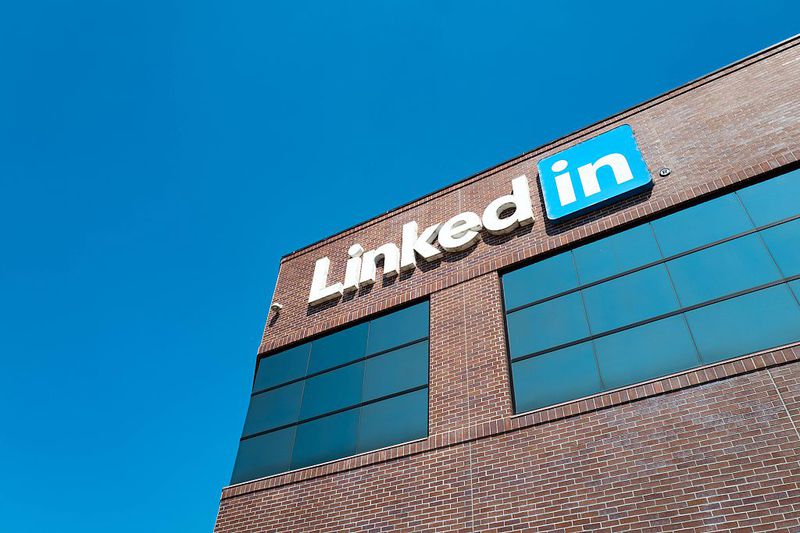 View of main building with logo and signage at the headquarters of professional social networking company LinkedIn.