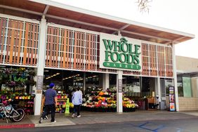 Whole Foods Market, Venice, California; a few people entering the store.