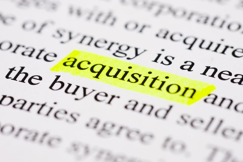Close-up of text with the word acquisition highlighted