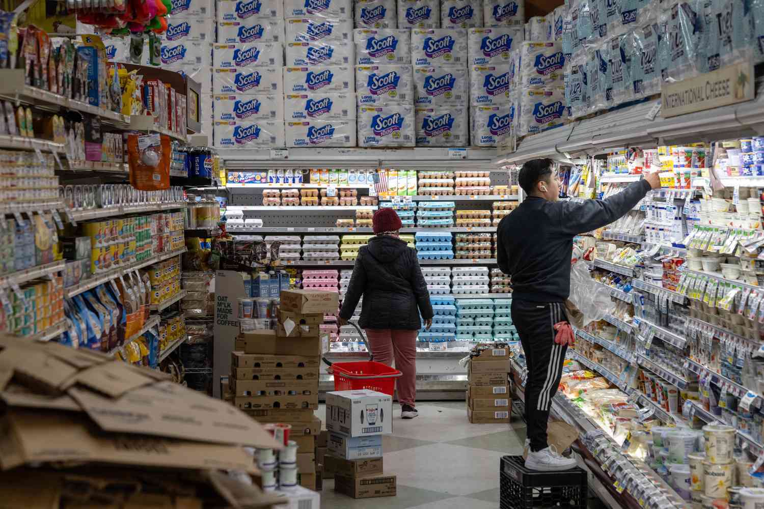 A shopper looks at egg cartons at a grocery store in New York, US, on Wednesday, Feb. 12, 2025.