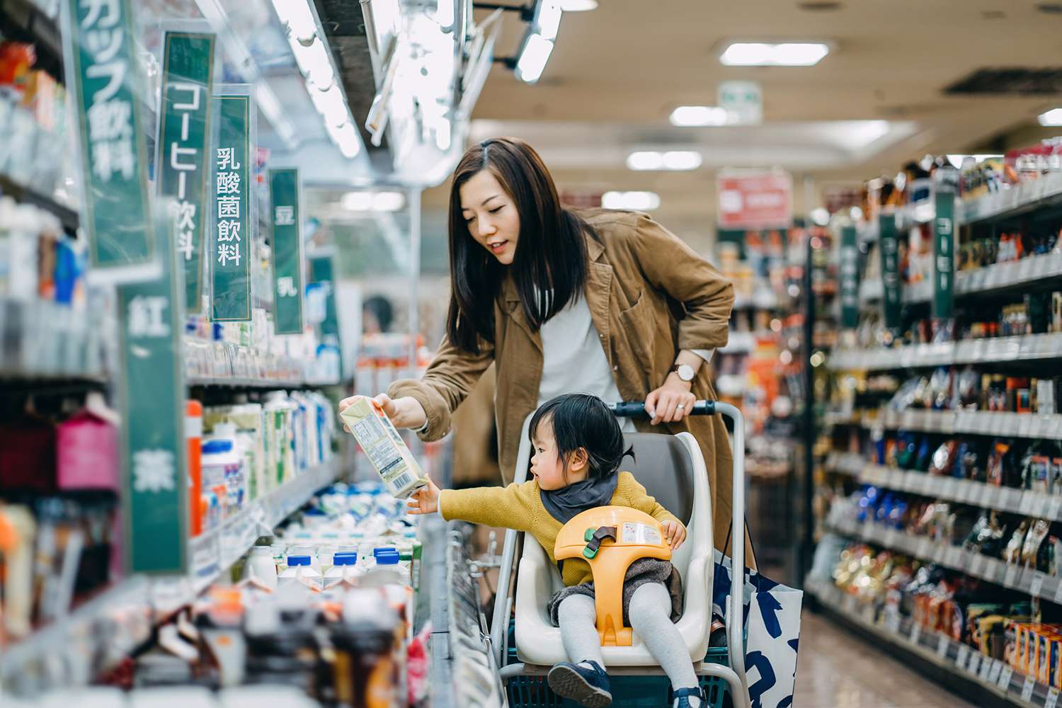 Daughter Sitting in a Shopping Cart Grocery Shopping