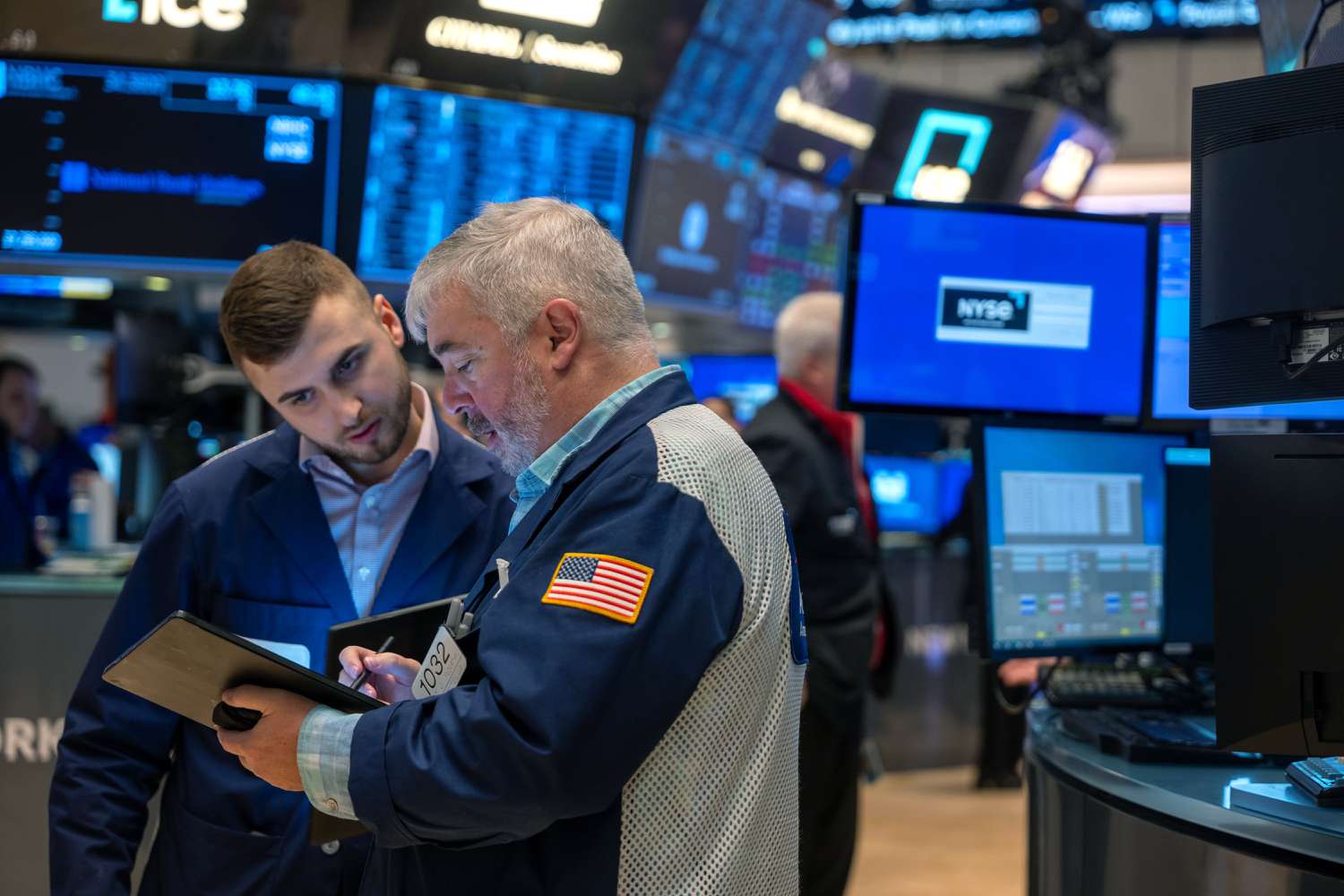 Traders work on the floor during morning trading at the New York Stock Exchange.