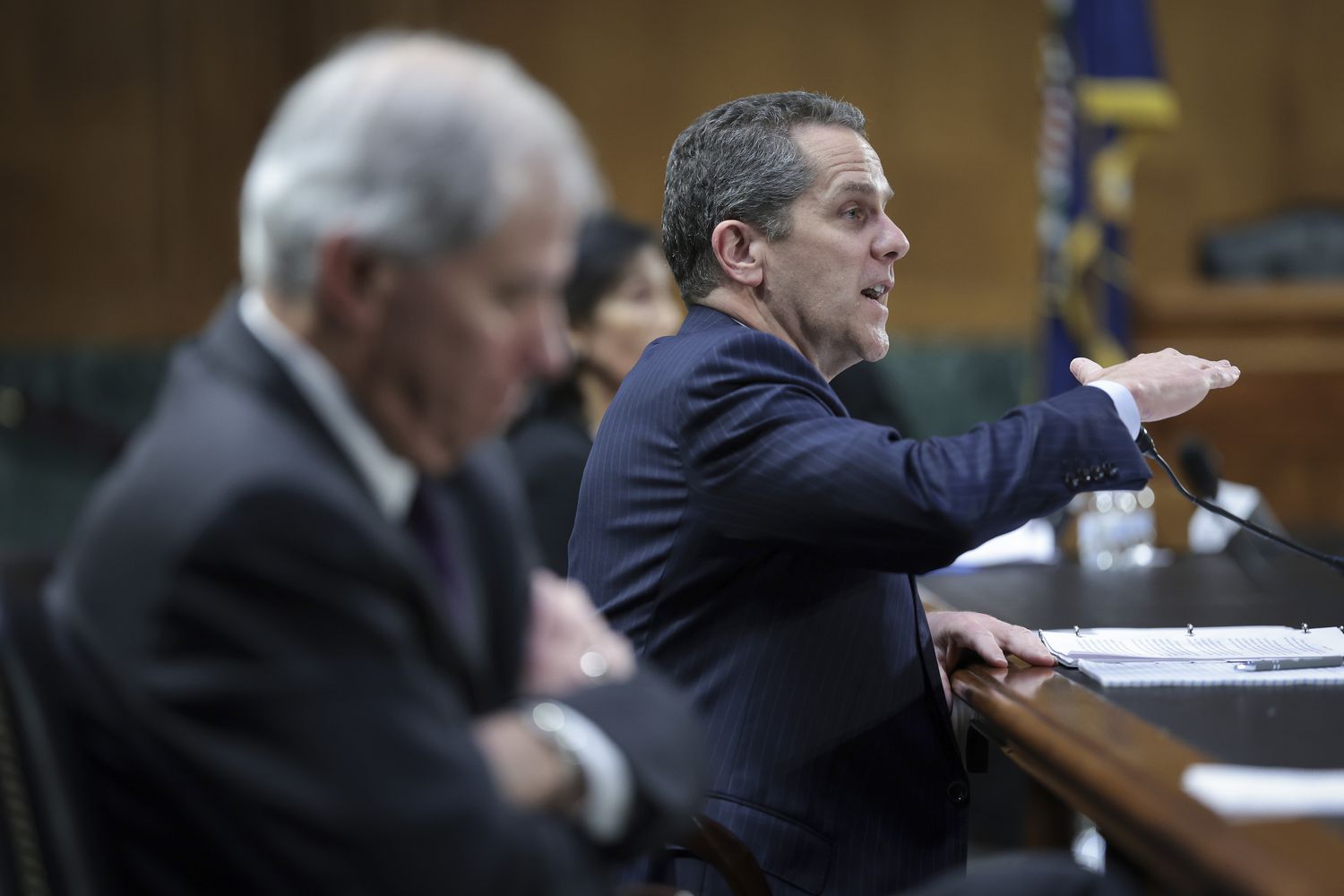Federal Reserve Board Vice Chair for Supervision Michael S. Barr (R) testifies before the Senate Banking, Housing and Urban Affairs Committee March 28, 2023 in Washington, DC. The committee heard testimony on the topic of "Recent Bank Failures and the Federal Regulatory Response." Also pictured is Federal Deposit Insurance Corporation Chairman Martin J. Gruenberg (L). 