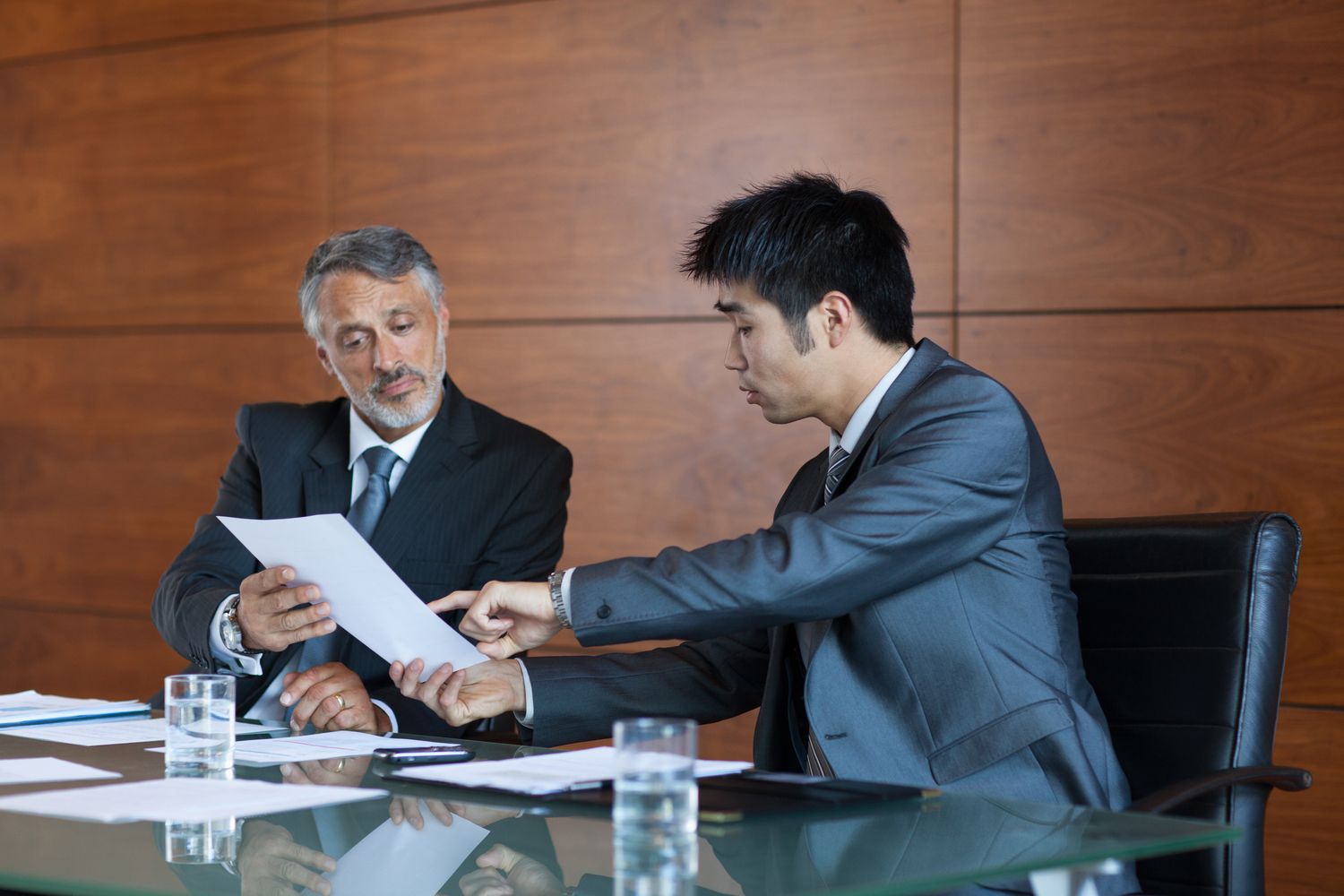 Two lenders discussing the escrow account of an FHA loan applicant