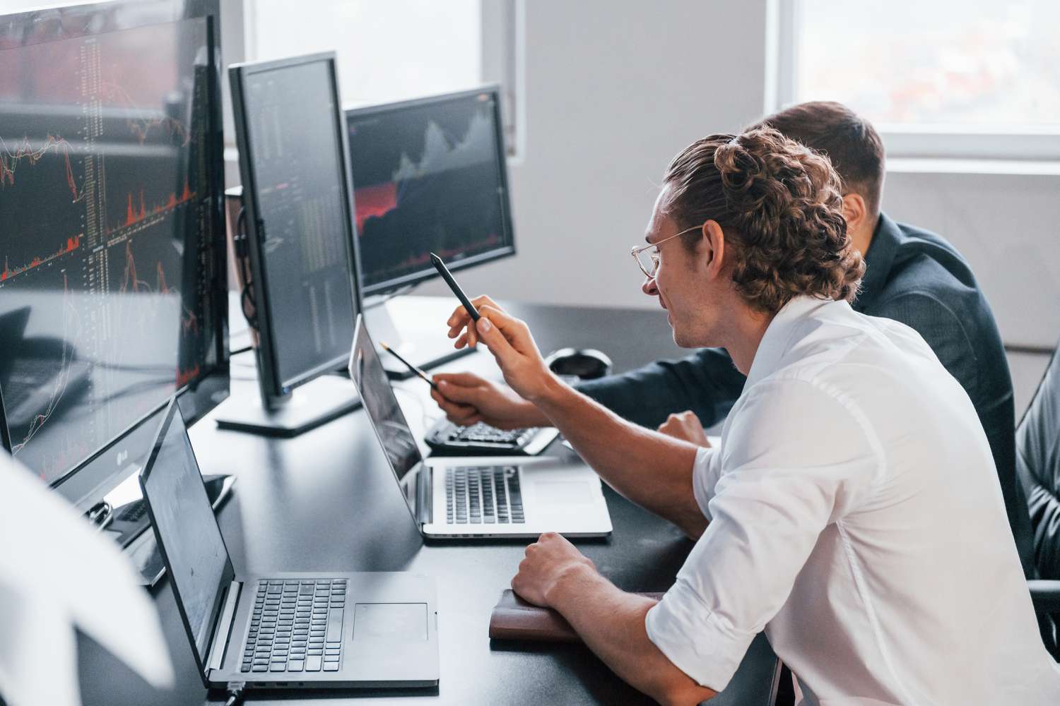 Stockbrokers choosing securities to do speculative investments.