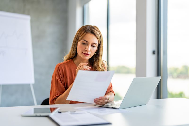 Woman reading an earnings withholding order