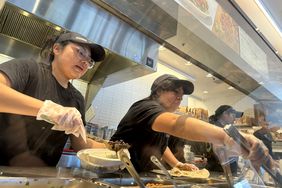 Workers at a San Rafael, California, Chipotle restaurant in April