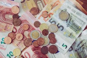 Messy pile or euro currency; notes and coins