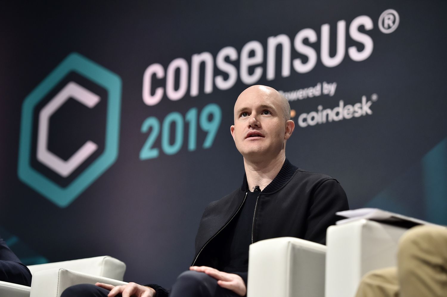 Coinbase CEO Brian Armstrong on stage at Consensus 2019 conference.
