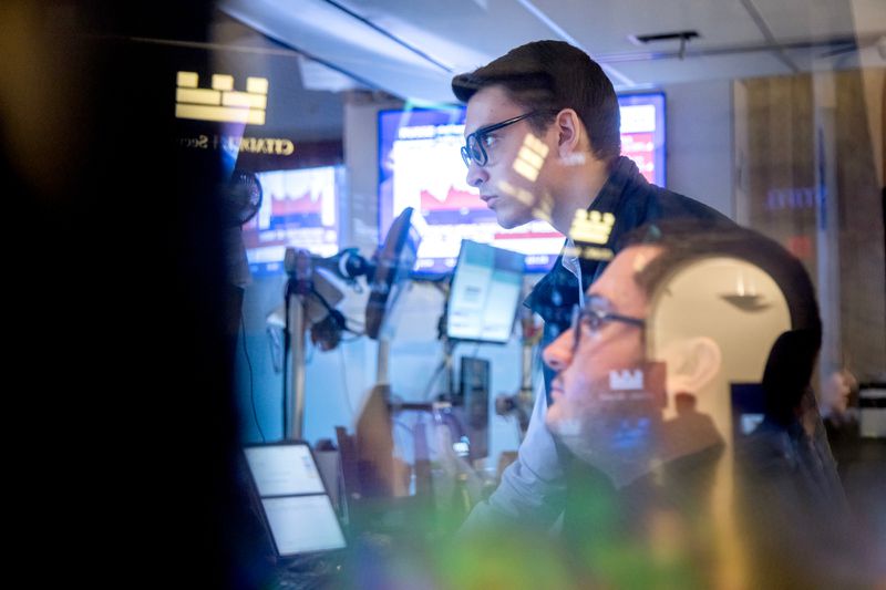 Traders work on the floor of the New York Stock Exchange