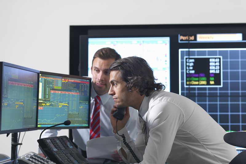 Financial Traders With Screens