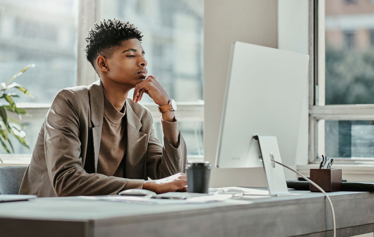 Employee researching on a computer how his company's Flexible Spending Account works