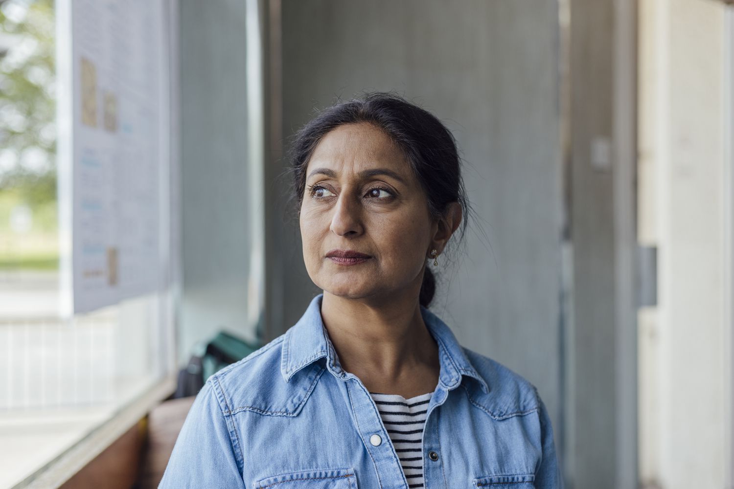 Older woman sitting inside
