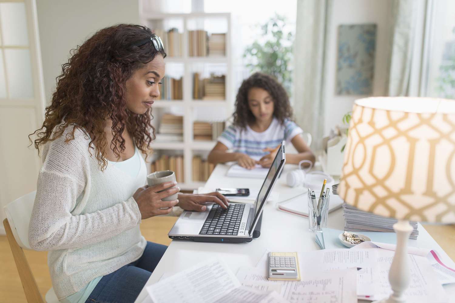 Woman at a computer with her daughter