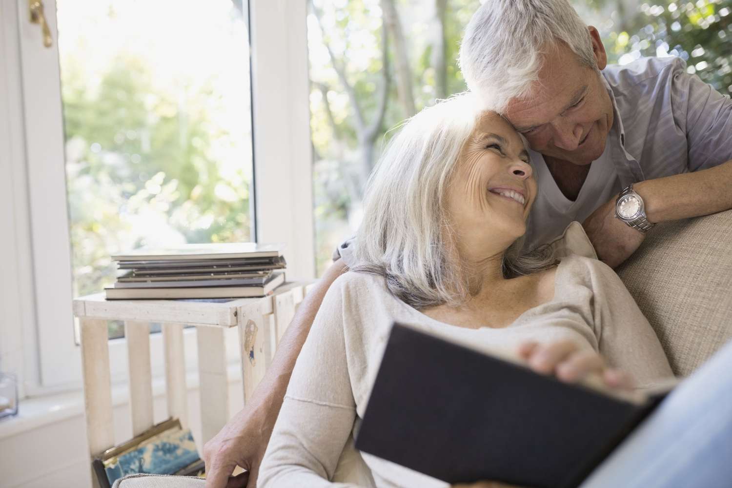 Older couple with their heads together, smiling
