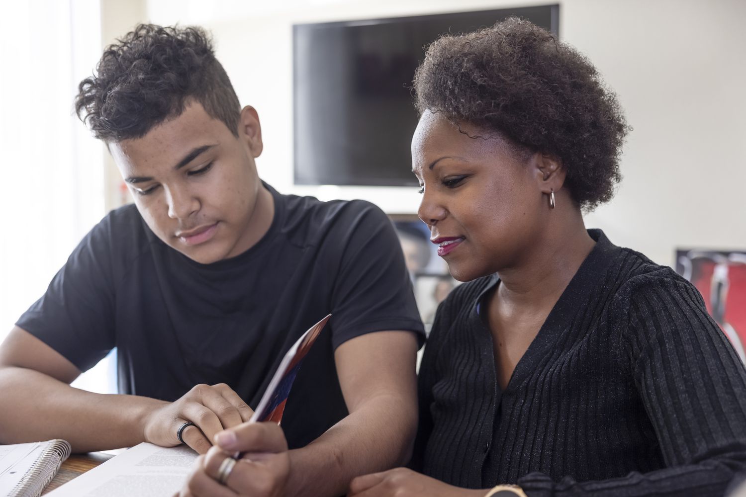 Mom and son doing homework together