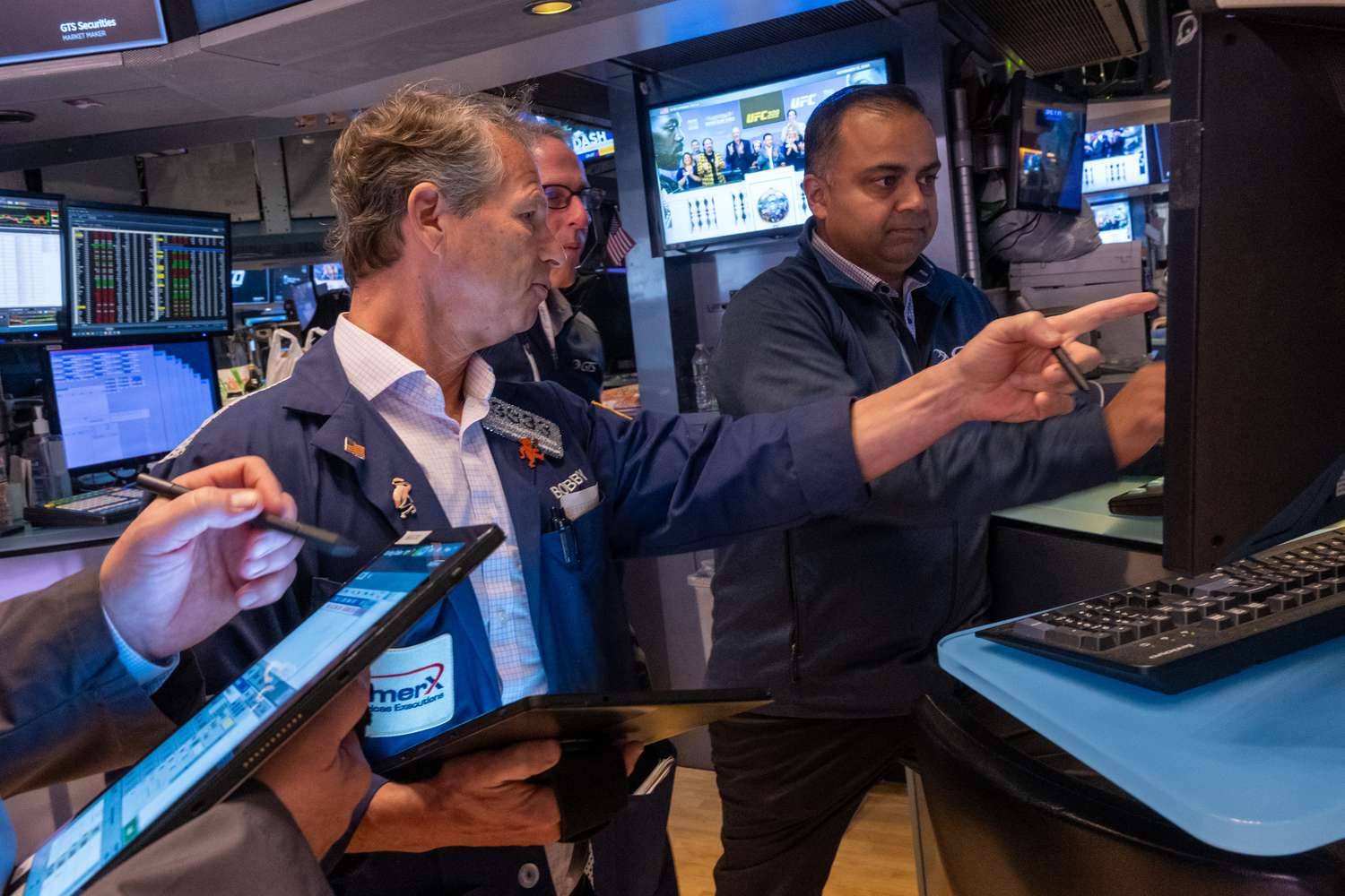Traders work on the New York Stock Exchange