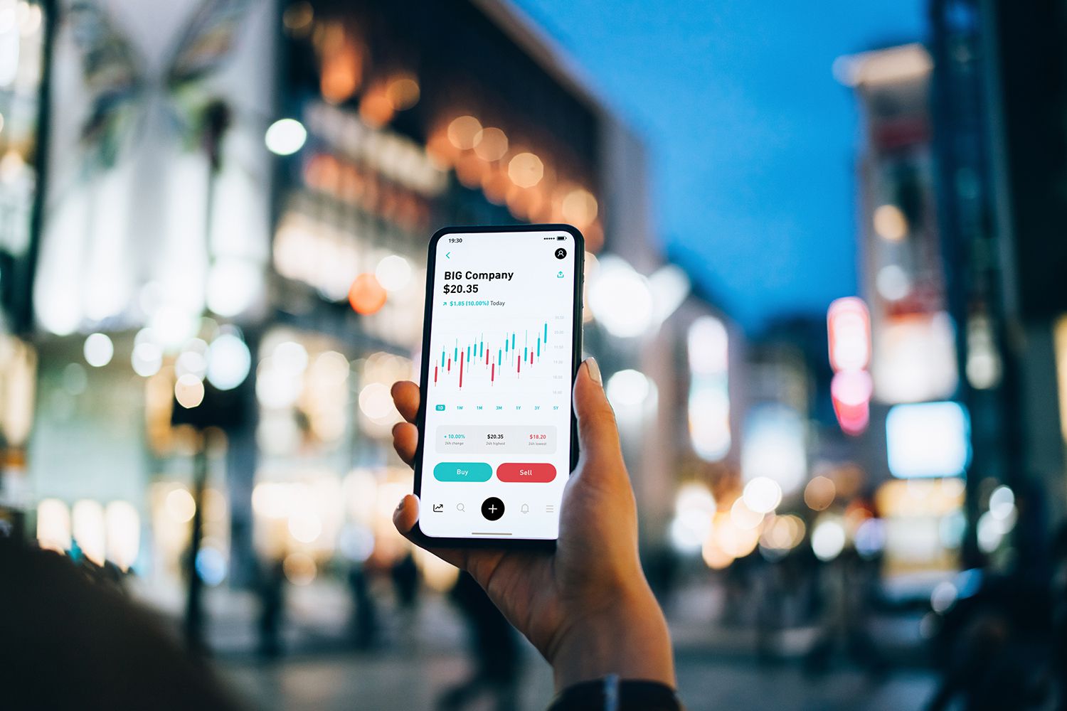 Close up of businesswoman reading financial stock market analysis on smartphone on the go