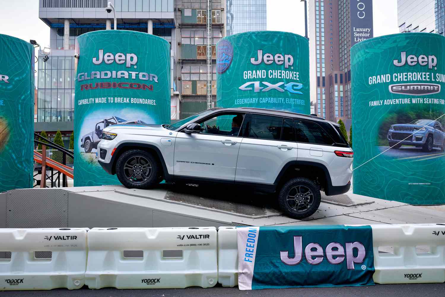 A 2024 Jeep Grand Cherokee 4xe plug-in hybrid sports utility vehicle (SUV) navigates an obstacle course at the 2024 New York International Auto Show (NYIAS) in New York on March 27, 2024