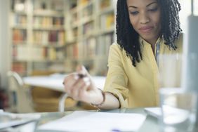 Woman doing paperwork at a desk