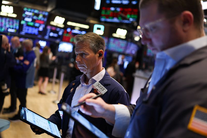 Traders work on the floor of the New York Stock Exchange 