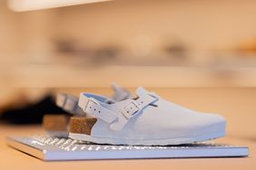 Birkenstock shoes are displayed on shelves