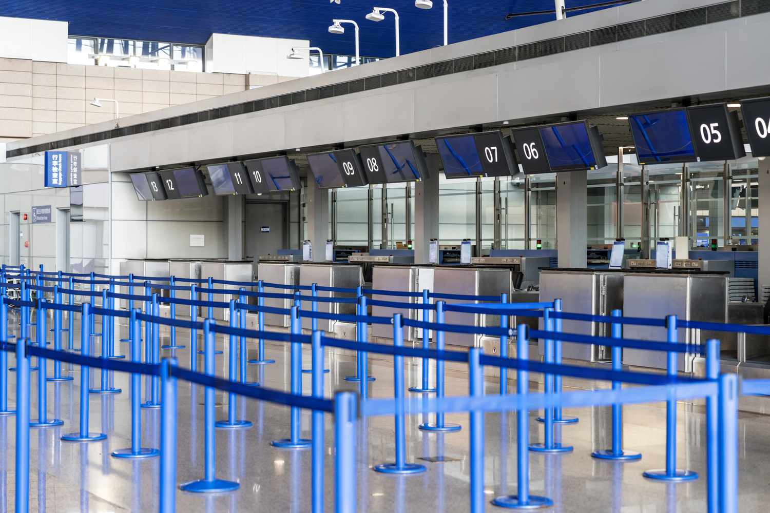 An airline checkout area with no customers in line