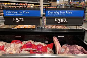 Walmart has signs touting low prices in the grocery section a Houston store. 