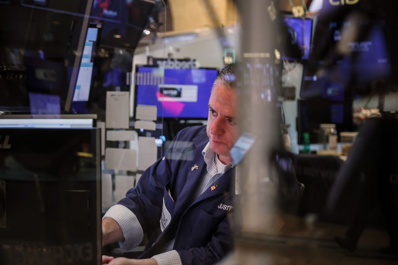 A trader works on the floor at the New York Stock Exchange.