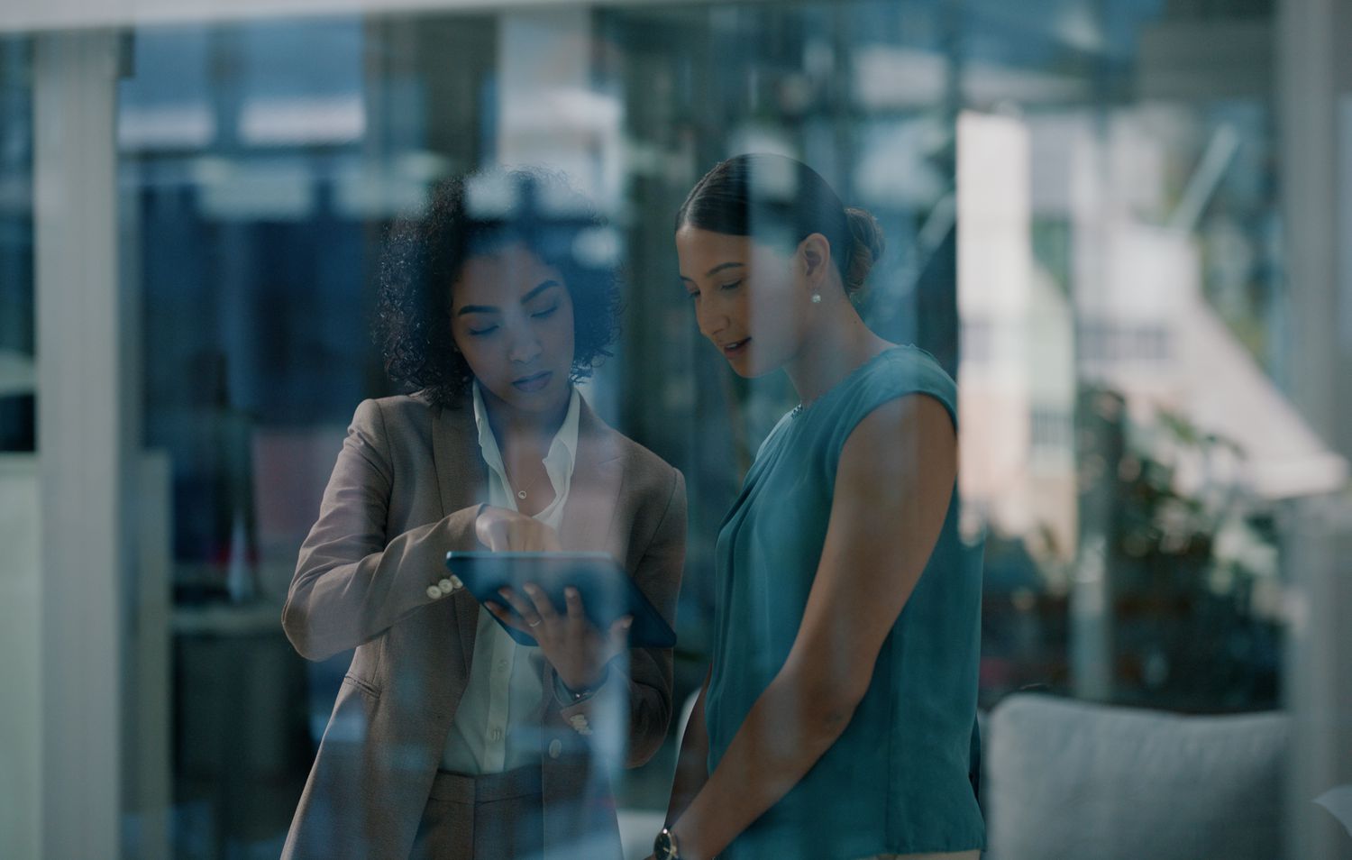 Women with tablet in office
