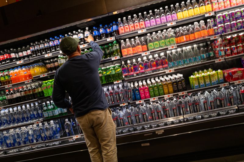 A man stocks shelves at a grocery store in Brooklyn on May 13, 2025 in New York City. 