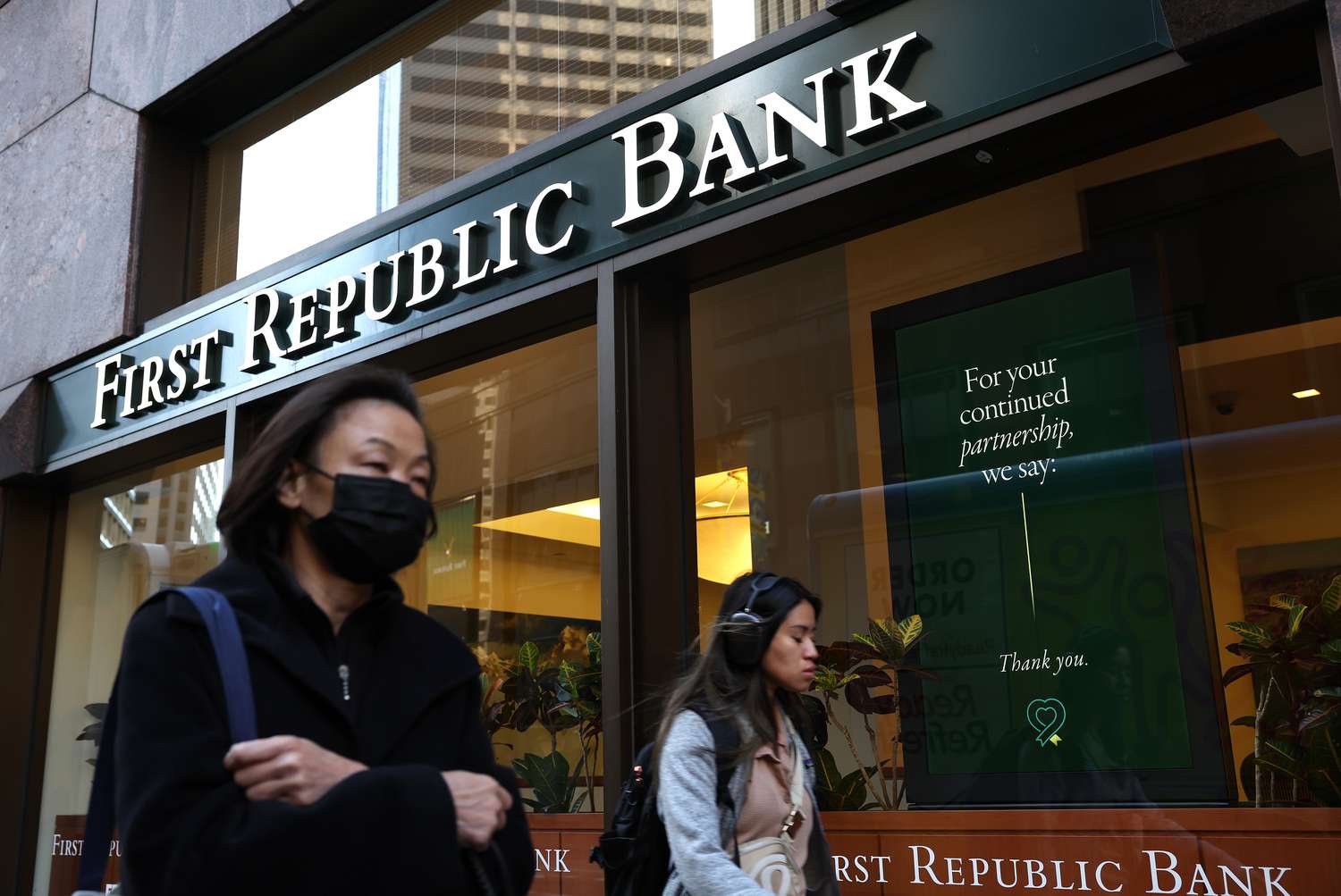 Pedestrians walk by a First Republic bank on April 26, 2023 in San Francisco, California. Shares of San Francisco-based bank First Republic continue to fall as the New York Stock Exchange halted trading of the stock at least a dozen times on Wednesday following the company's earnings report that showed its clients had withdrew more than 40% of deposits in the first quarter following the collapse of Silicon Valley Bank.