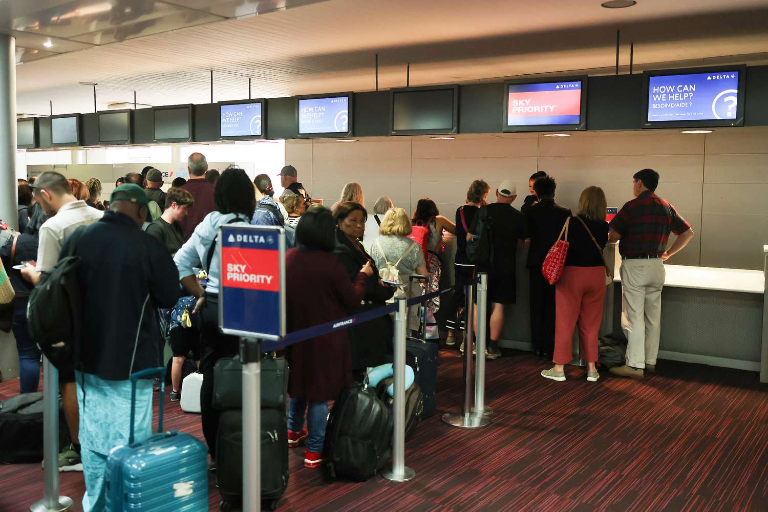 Delta Airlines airport transfer desk seen crowded due to airline cancellations and delays at Paris-Charles de Gaulle Airport on July 19, 2024 in Paris, France