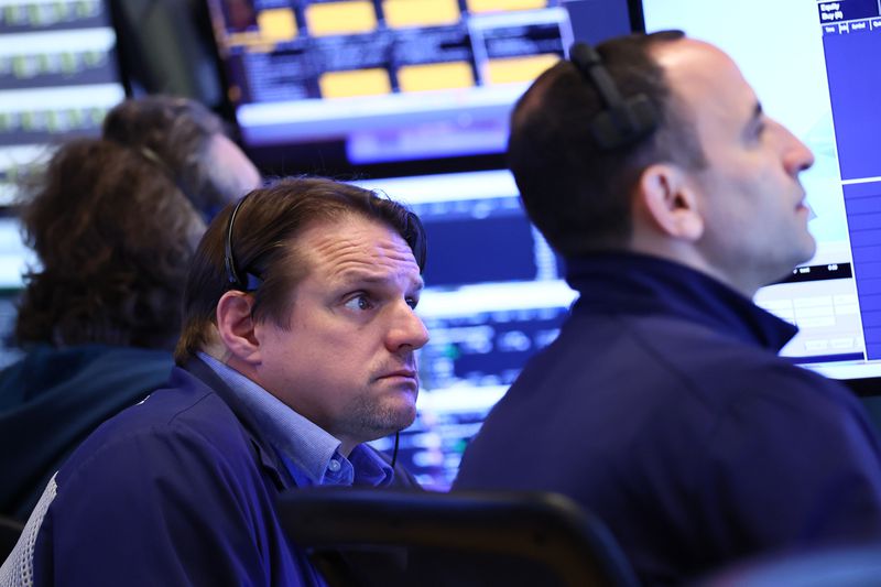 Traders work on the floor of the New York Stock Exchange
